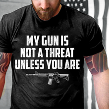 Load image into Gallery viewer, My Guns Is Not A Threat Unless You Are T-Shirt